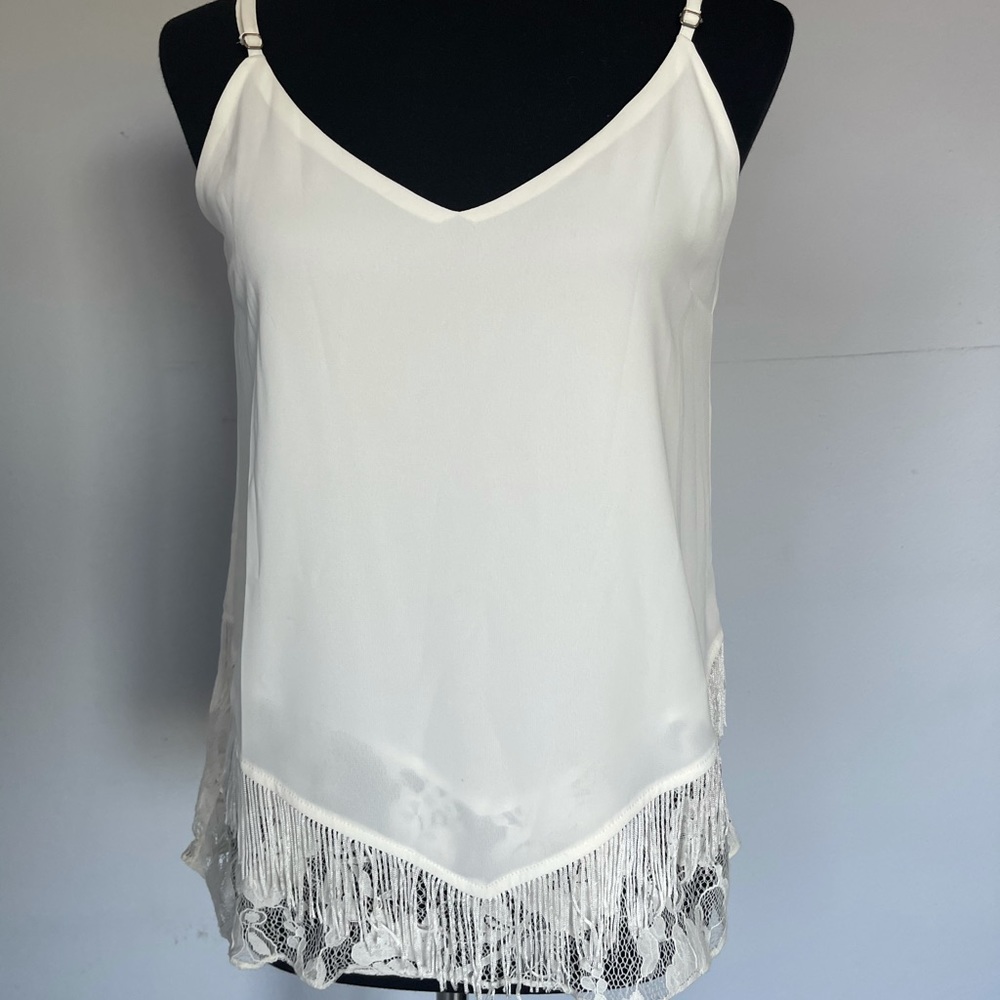 White top with a detail in bottom